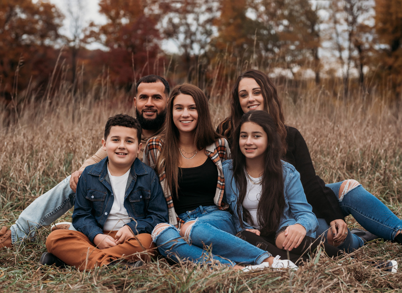 Family Photography, family of 5 sitting in tall grass