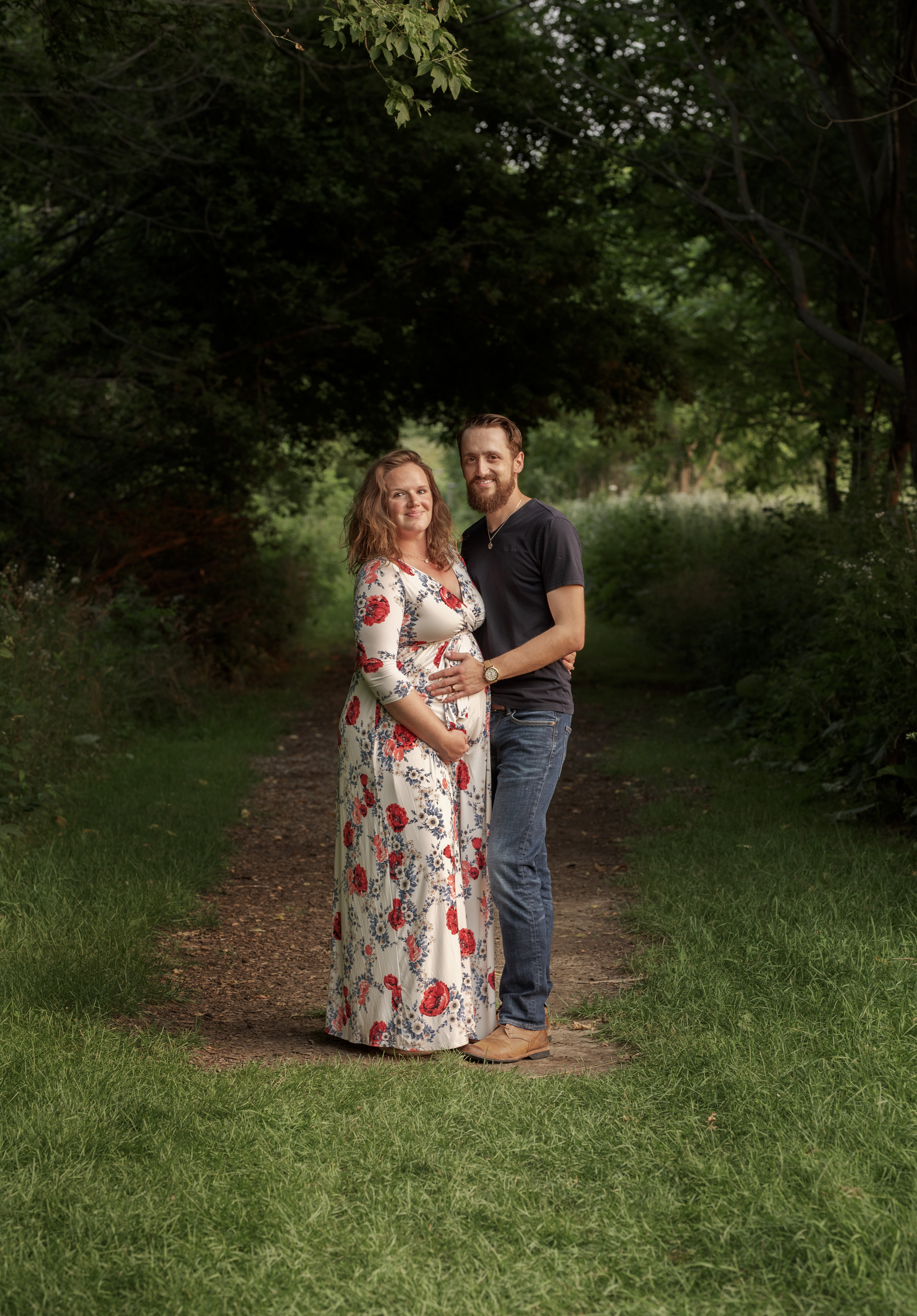 grand rapids maternity photo shoot women in red dress outdoors