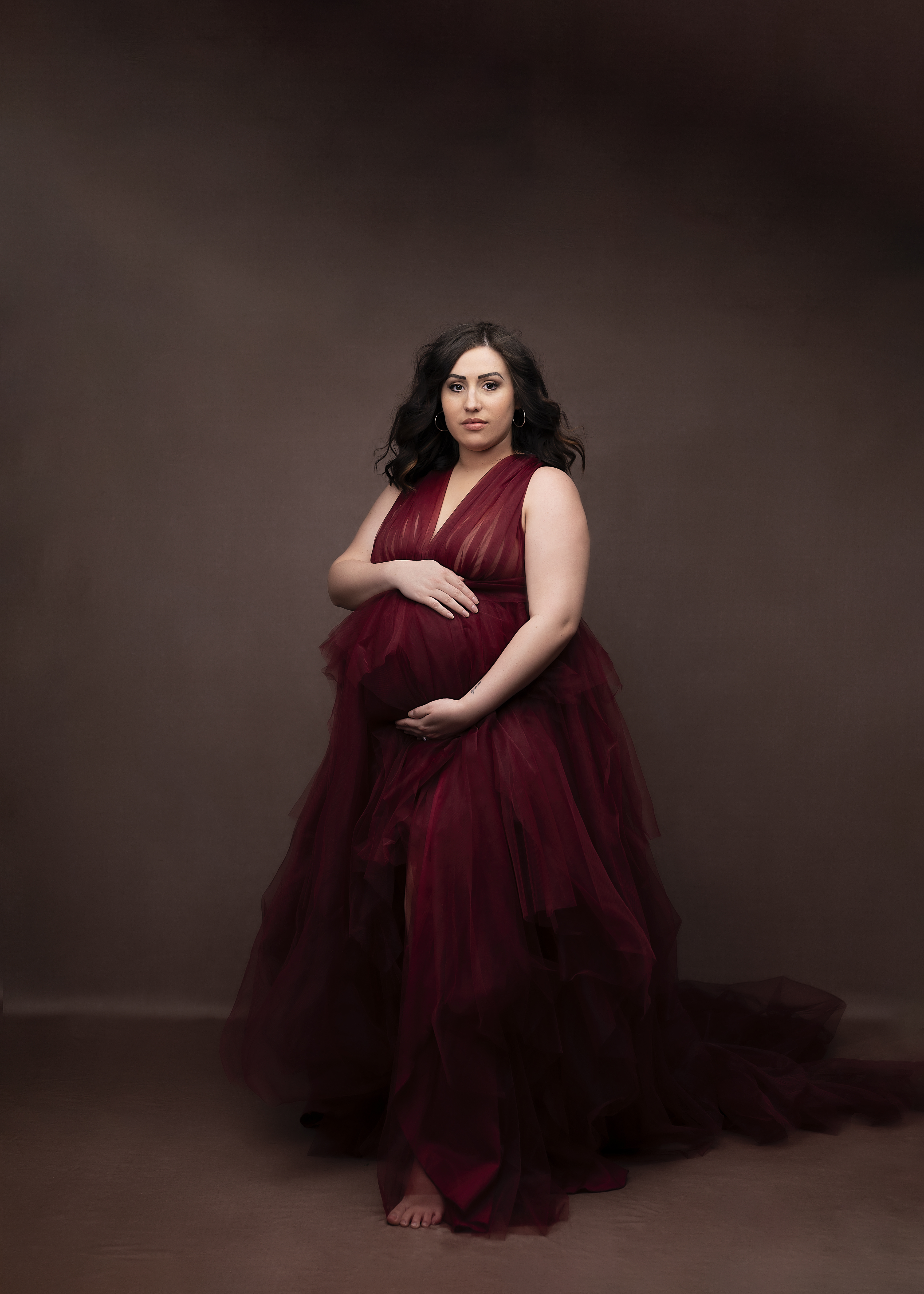 grand rapids maternity photo shoot women in red gown