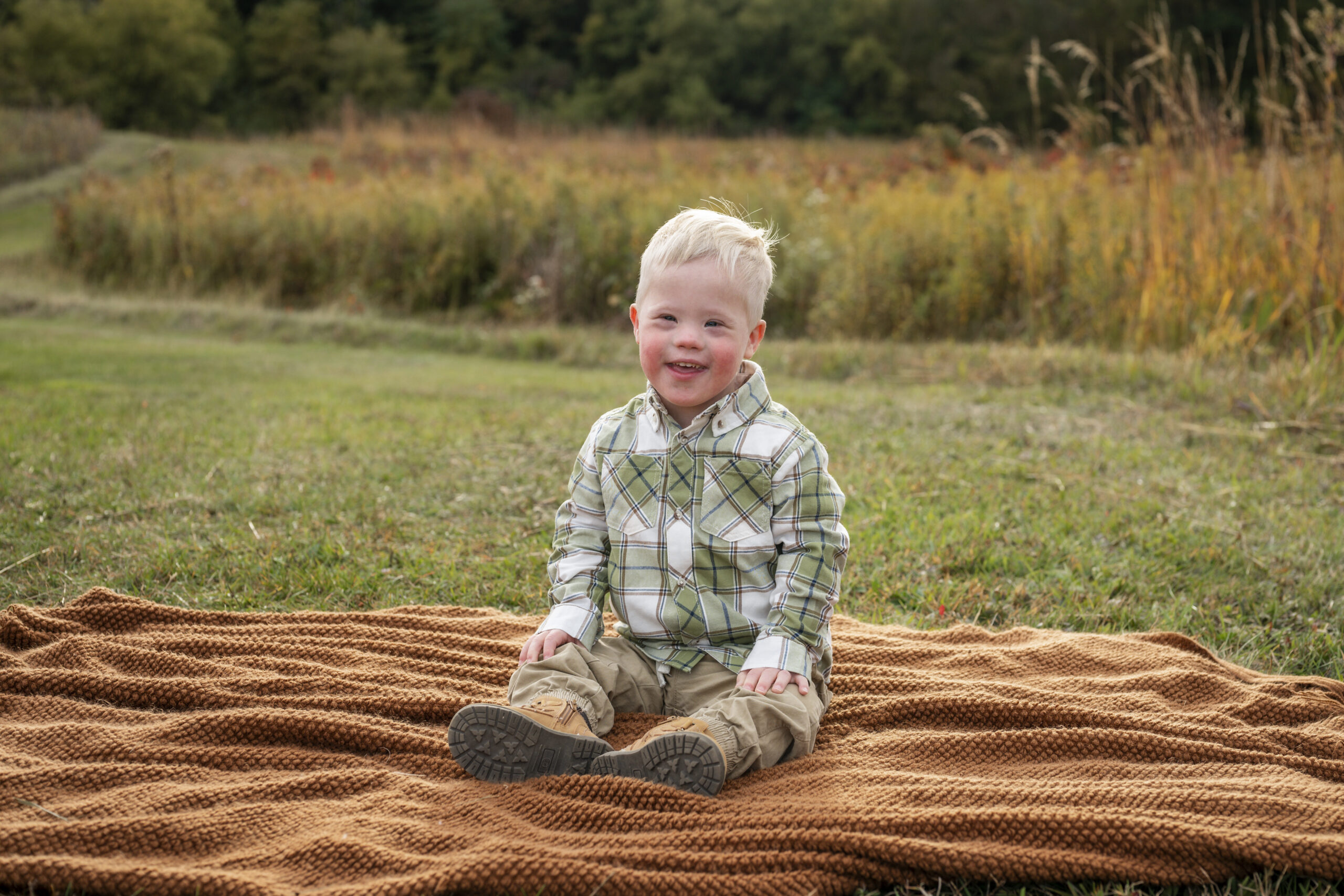 Grand rapids family photography photo session son smiling at camera
