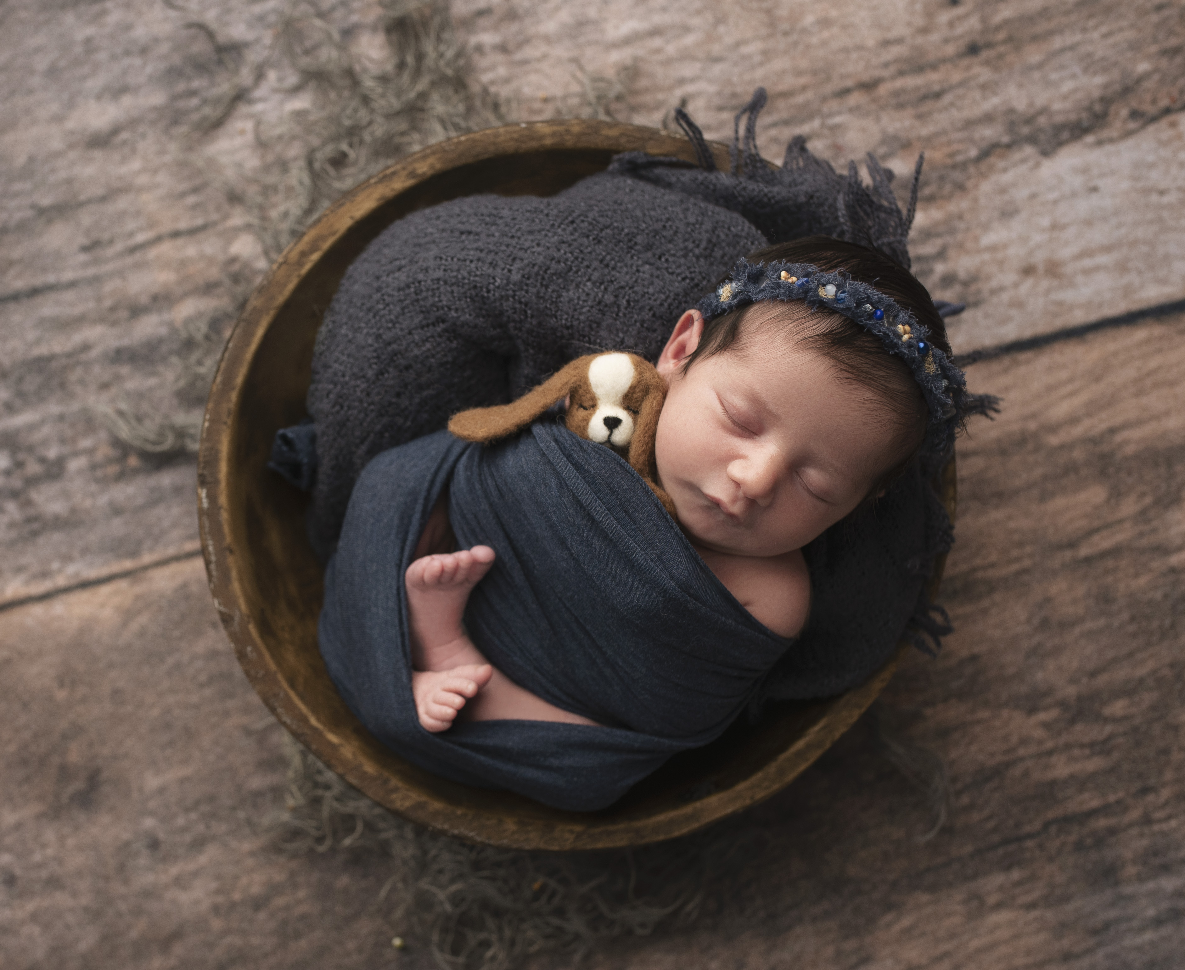 Newborn grand rapids photographer baby swaddled in a bowl