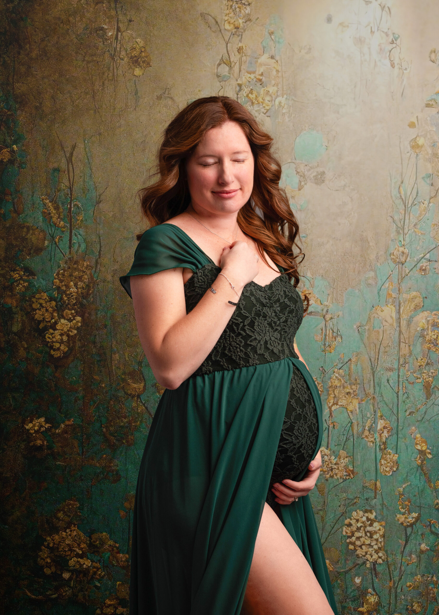 grand rapids maternity photo shoot mother in green dress with red hair